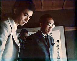1973, Tun Rahman's a courtesy call to Kisshomaru Doshu at Hombu Dojo, looking at O'Sensei's calligraphy.