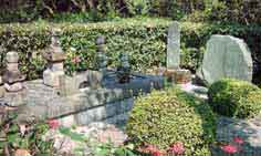 Graveyard of Rev. Eyi Tansetu Yamada and wife Kou beside the house with ancestral tombs.